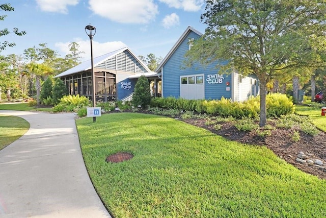 view of home's community featuring a yard