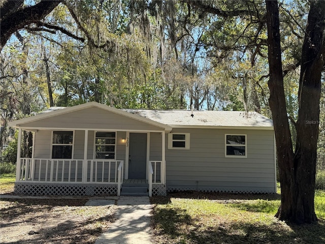 ranch-style house with covered porch