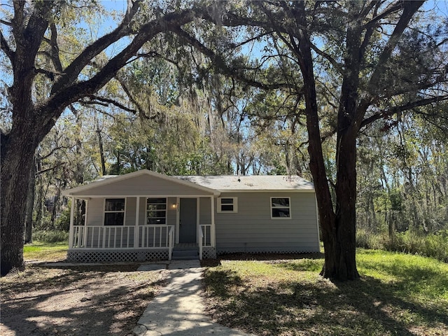 single story home featuring covered porch