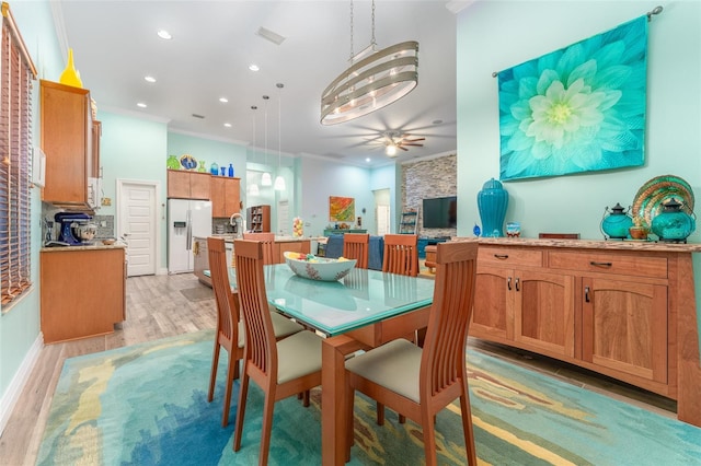 dining room with light wood-style flooring, recessed lighting, visible vents, a ceiling fan, and crown molding