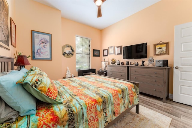 bedroom with ceiling fan and light wood-style floors