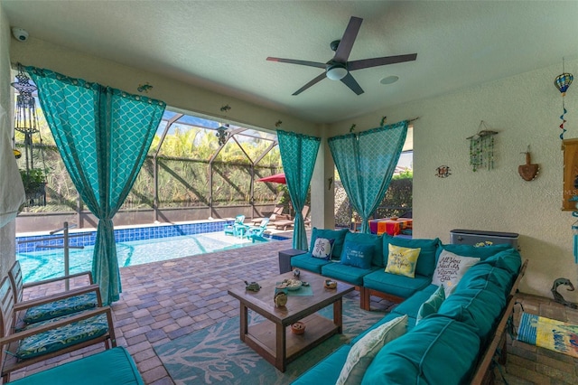 exterior space with brick floor, a textured wall, a sunroom, ceiling fan, and a textured ceiling