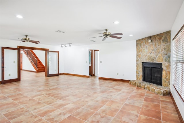 unfurnished living room with visible vents, baseboards, recessed lighting, a fireplace, and ceiling fan