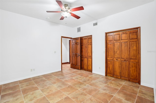 unfurnished bedroom with visible vents, a ceiling fan, and baseboards