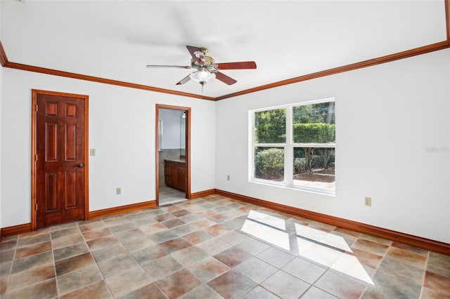 empty room featuring baseboards, ceiling fan, and crown molding