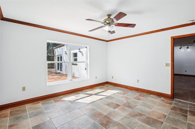 spare room with baseboards, ornamental molding, and a ceiling fan