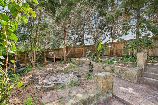 view of yard featuring a patio and a fenced backyard