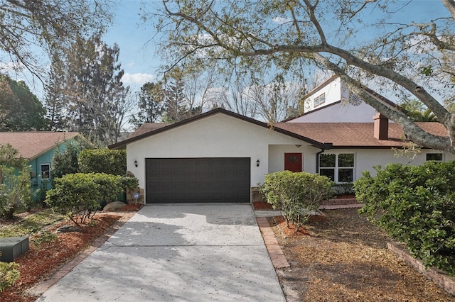 view of front facade featuring stucco siding, driveway, a shingled roof, and a garage