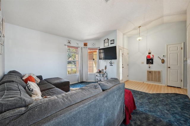 carpeted living room featuring visible vents, vaulted ceiling, a textured ceiling, and baseboards