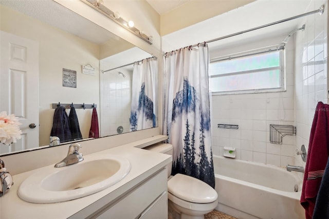 bathroom featuring toilet, shower / tub combo, and vanity