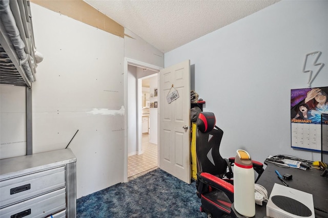 office featuring lofted ceiling, a textured ceiling, and dark carpet