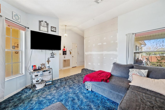 carpeted living area featuring lofted ceiling and visible vents