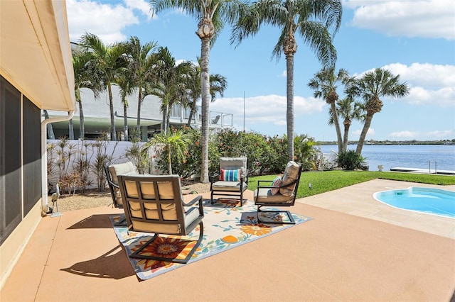 view of patio / terrace with fence and a water view