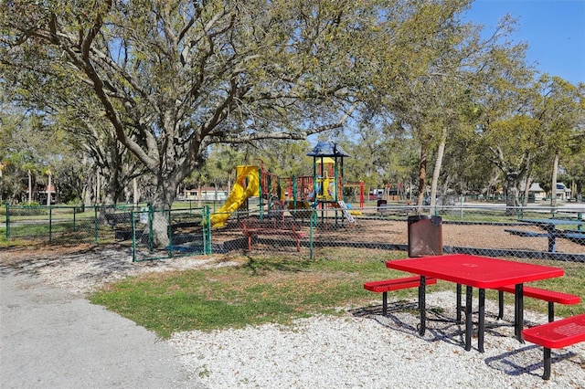 communal playground featuring fence