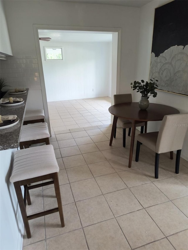 dining area with light tile patterned floors