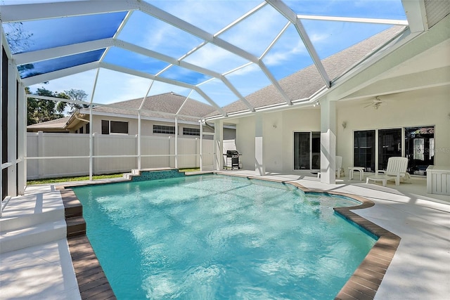 view of swimming pool with a fenced in pool, a patio area, ceiling fan, and fence