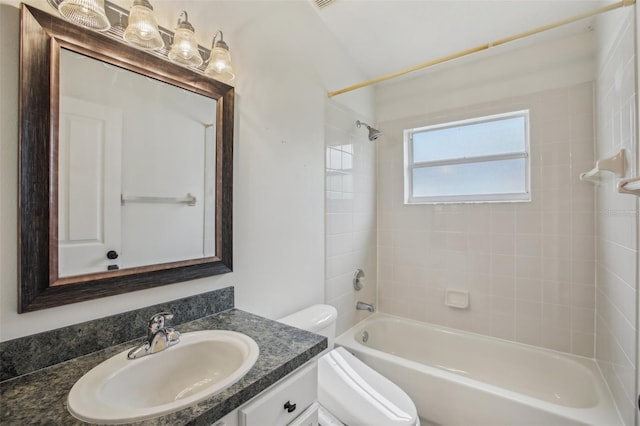 full bathroom with  shower combination, vanity, and toilet