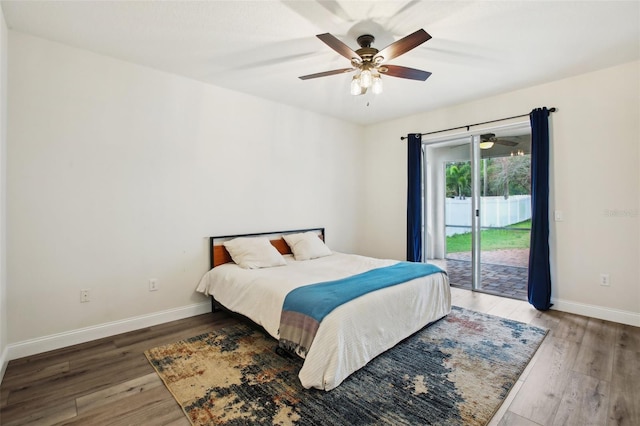 bedroom featuring light wood-type flooring, access to outside, baseboards, and a ceiling fan