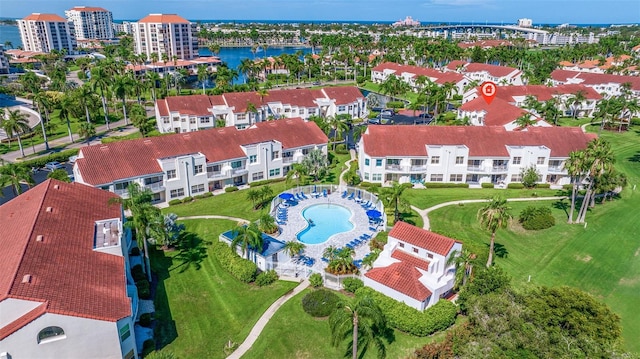 birds eye view of property with a water view