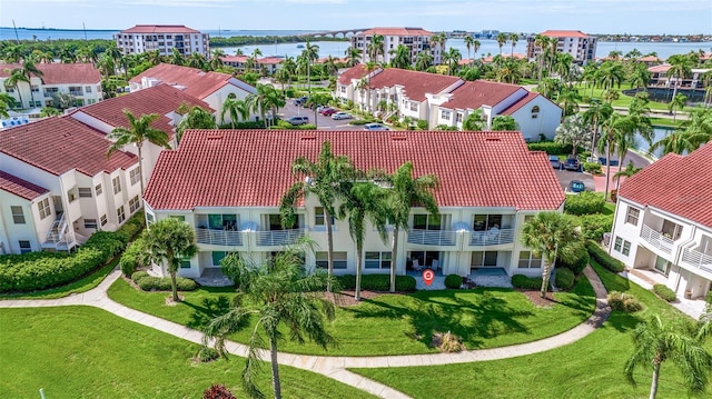 bird's eye view featuring a residential view and a water view