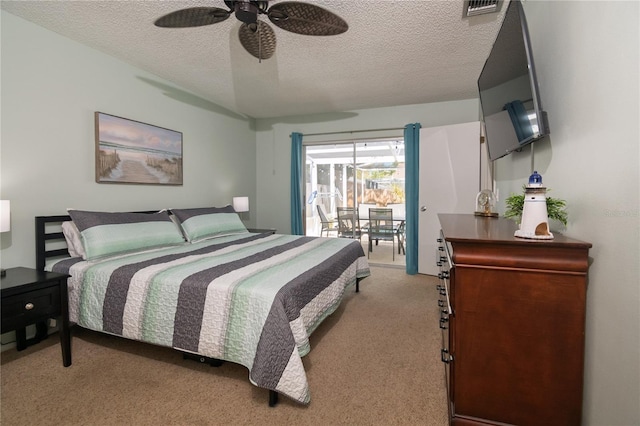 bedroom featuring a ceiling fan, visible vents, a textured ceiling, access to outside, and light colored carpet