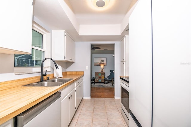 kitchen with white cabinetry, electric range, a sink, light countertops, and dishwasher