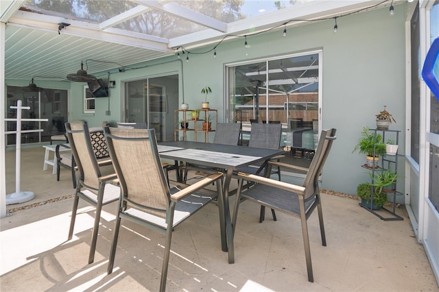 view of patio / terrace with a lanai and outdoor dining space