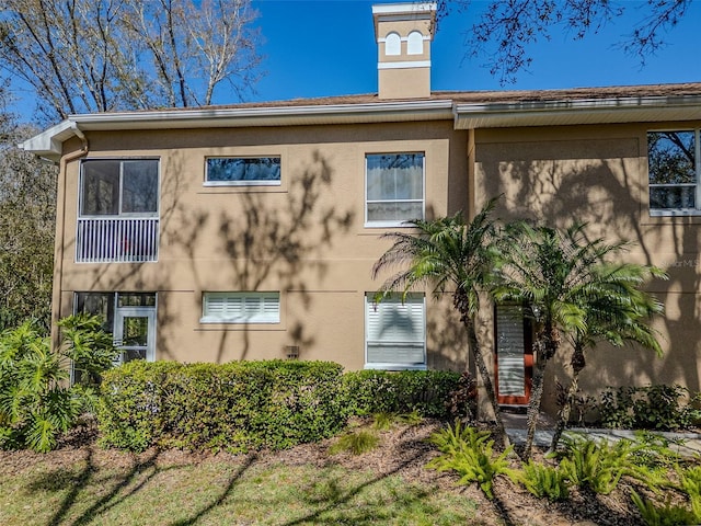 view of side of property featuring stucco siding