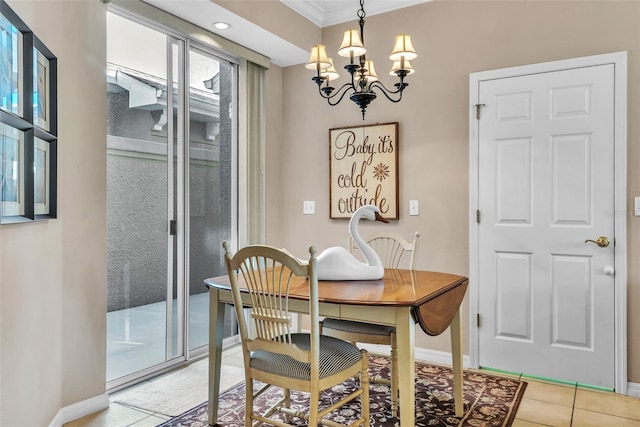 dining space featuring baseboards, a chandelier, crown molding, and light tile patterned flooring