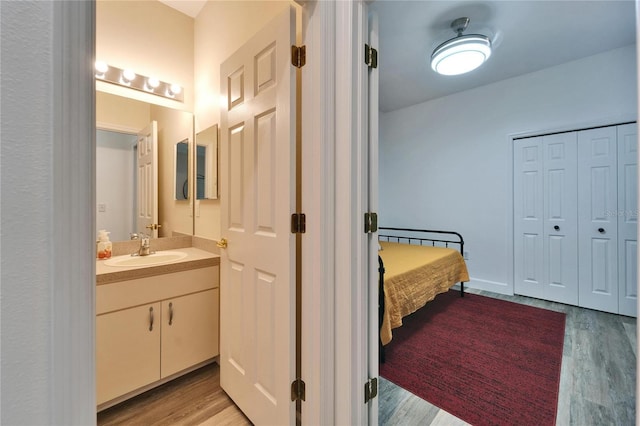 bathroom featuring vanity and wood finished floors