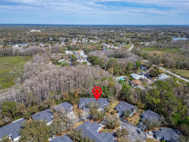 bird's eye view featuring a view of trees and a residential view