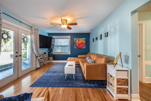 living room with ceiling fan, french doors, wood finished floors, and baseboards