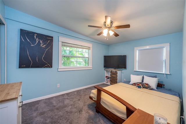 carpeted bedroom featuring ceiling fan and baseboards