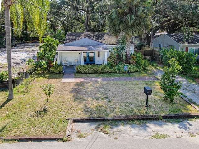 view of front of house featuring a front yard and fence