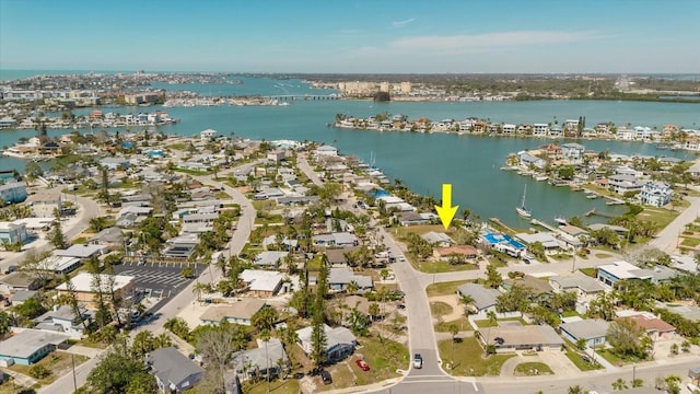 drone / aerial view featuring a water view and a residential view