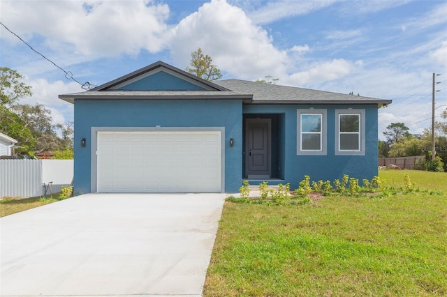 single story home featuring concrete driveway, an attached garage, fence, a front yard, and stucco siding