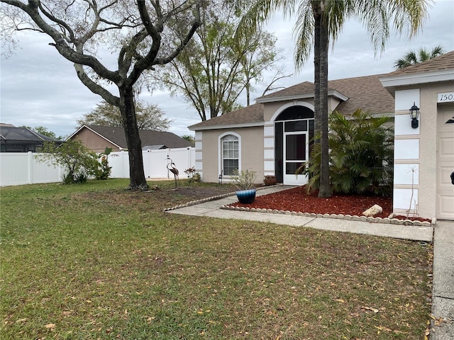 view of yard with a garage and fence