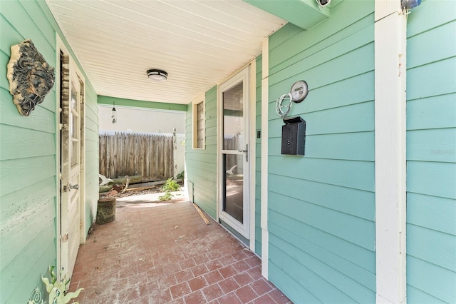 view of patio featuring fence