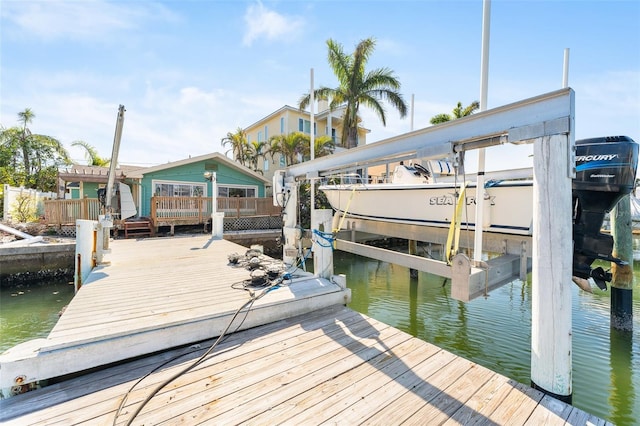 dock area featuring a water view and boat lift