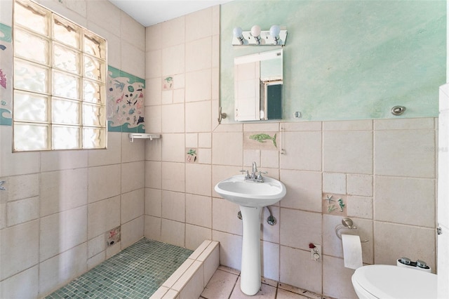 full bath featuring tile walls, a shower stall, and toilet