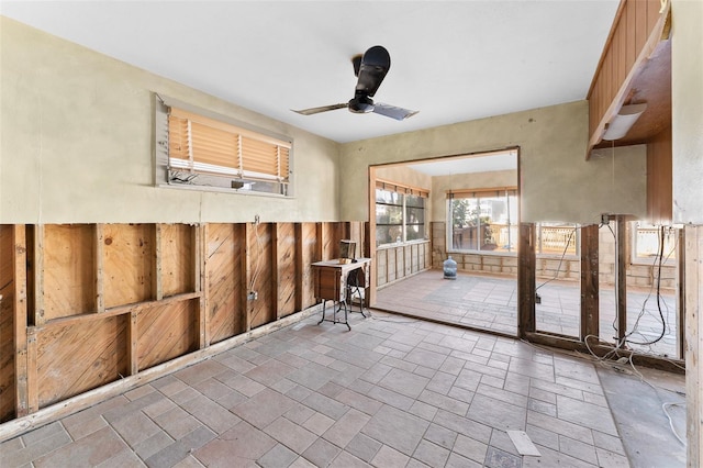 interior space featuring ceiling fan