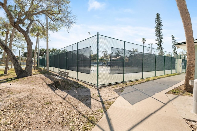 view of tennis court with fence