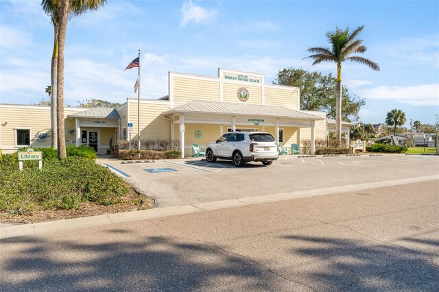 view of property with uncovered parking