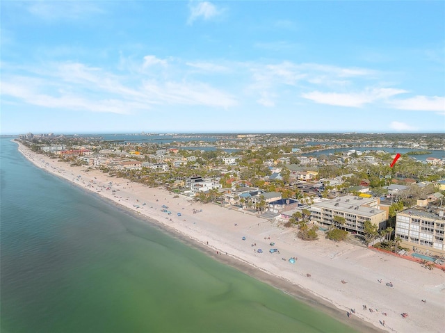 drone / aerial view featuring a view of the beach and a water view