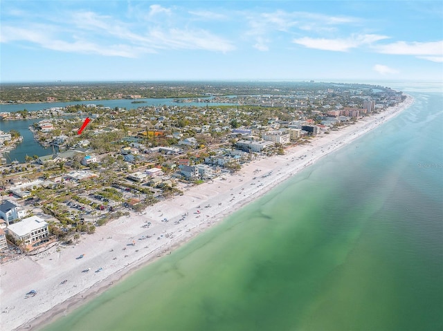 drone / aerial view featuring a water view and a view of the beach