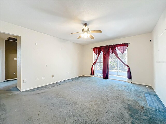 empty room with ceiling fan and baseboards