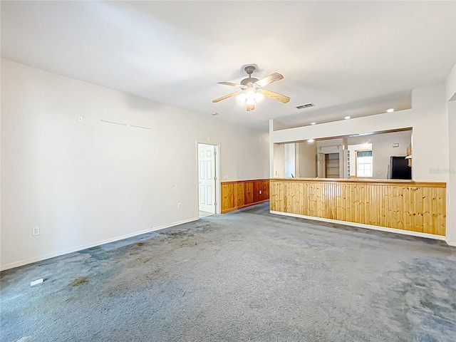 spare room with visible vents and a ceiling fan