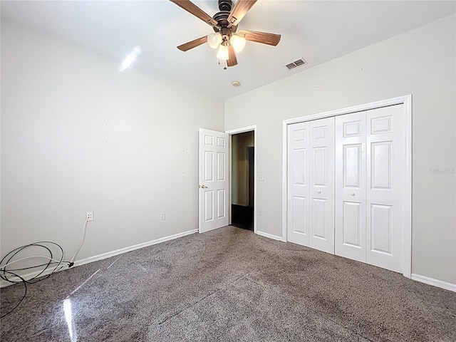 unfurnished bedroom featuring carpet, baseboards, visible vents, and a closet