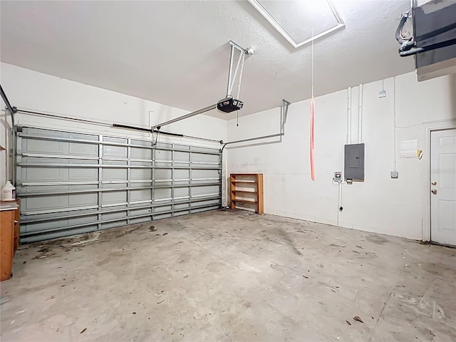 garage featuring electric panel and a garage door opener