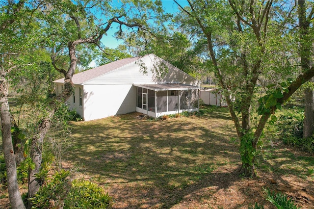 view of yard with a sunroom